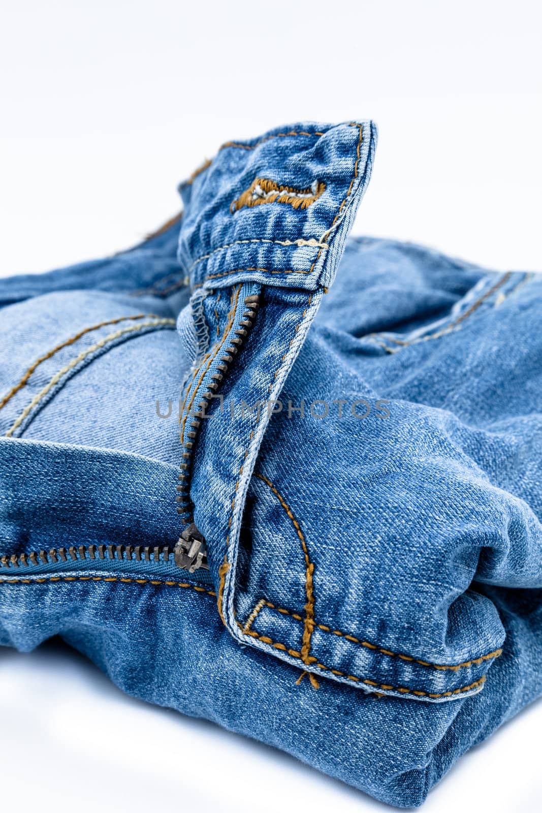 Blue jeans trousers on a white background
