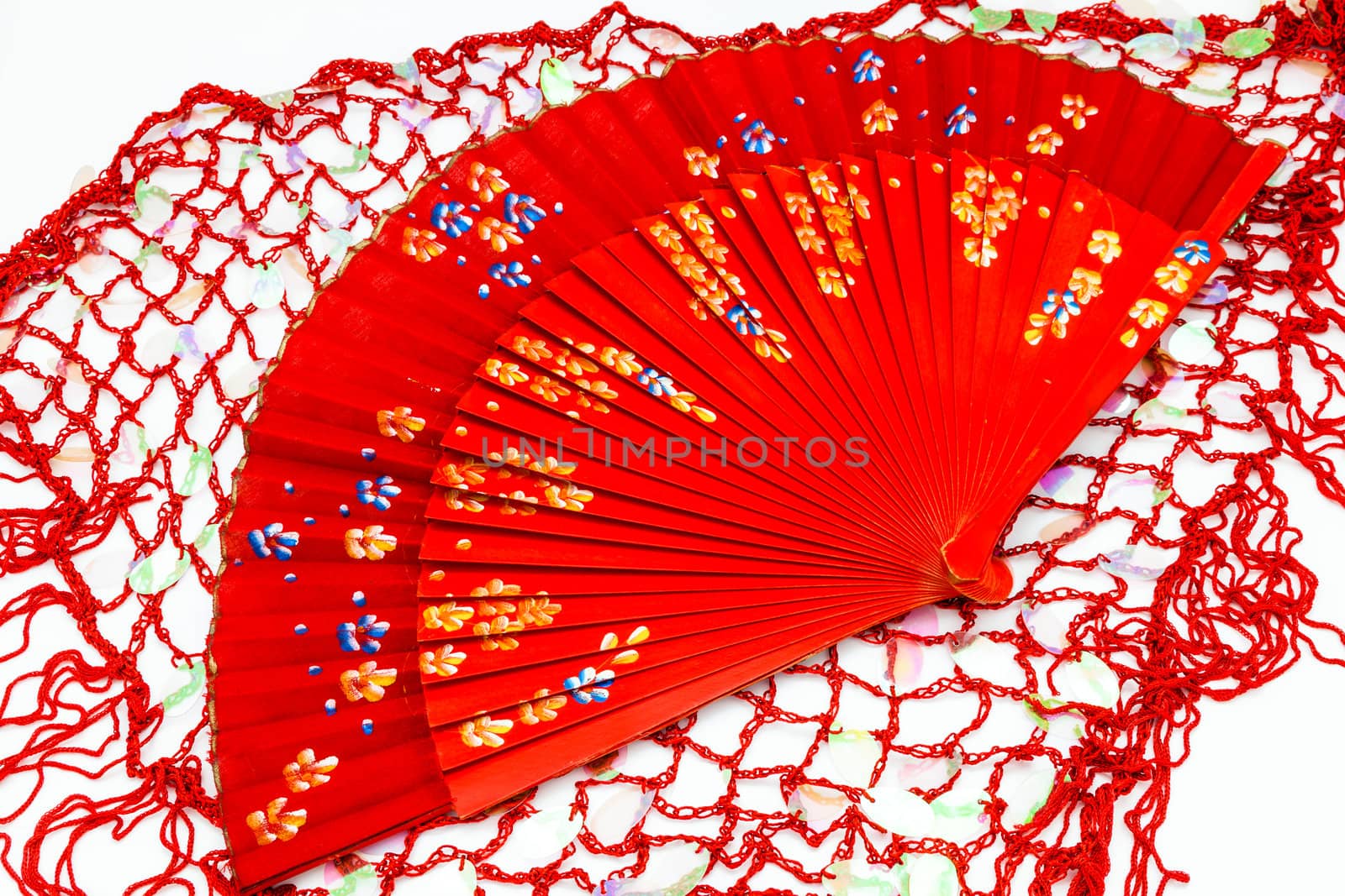 Red spanish fan on a white background