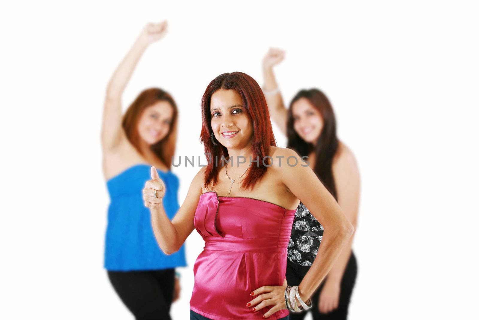 Group of happy young women standing together. Friendship. Isolated over white.