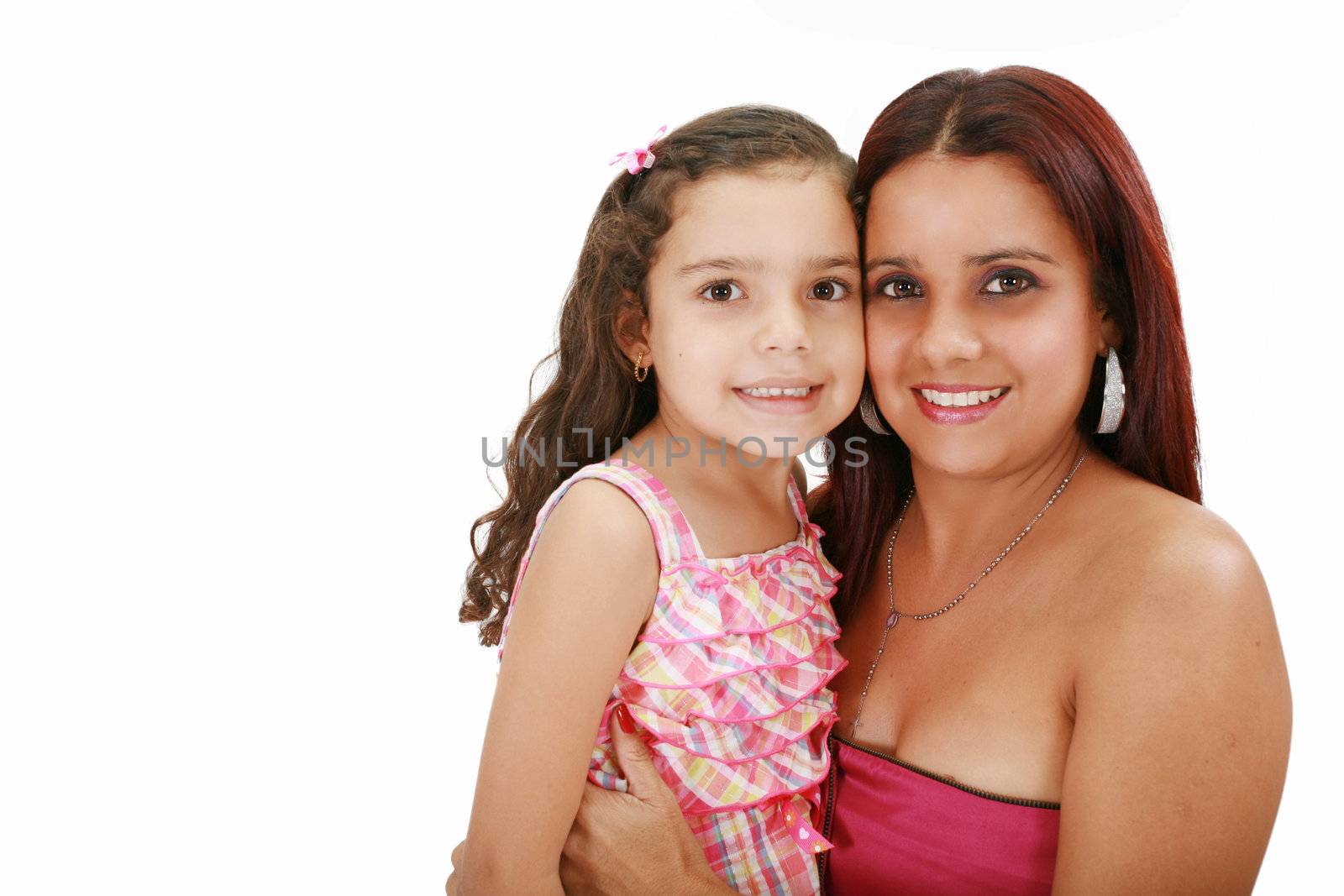 Young latin mother hugging her daughter isolated on a white background
