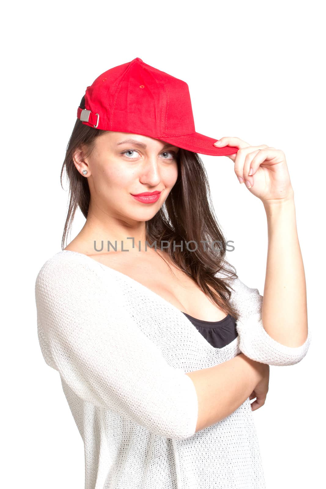 Attractive young woman wearing a red baseball cap by gsdonlin