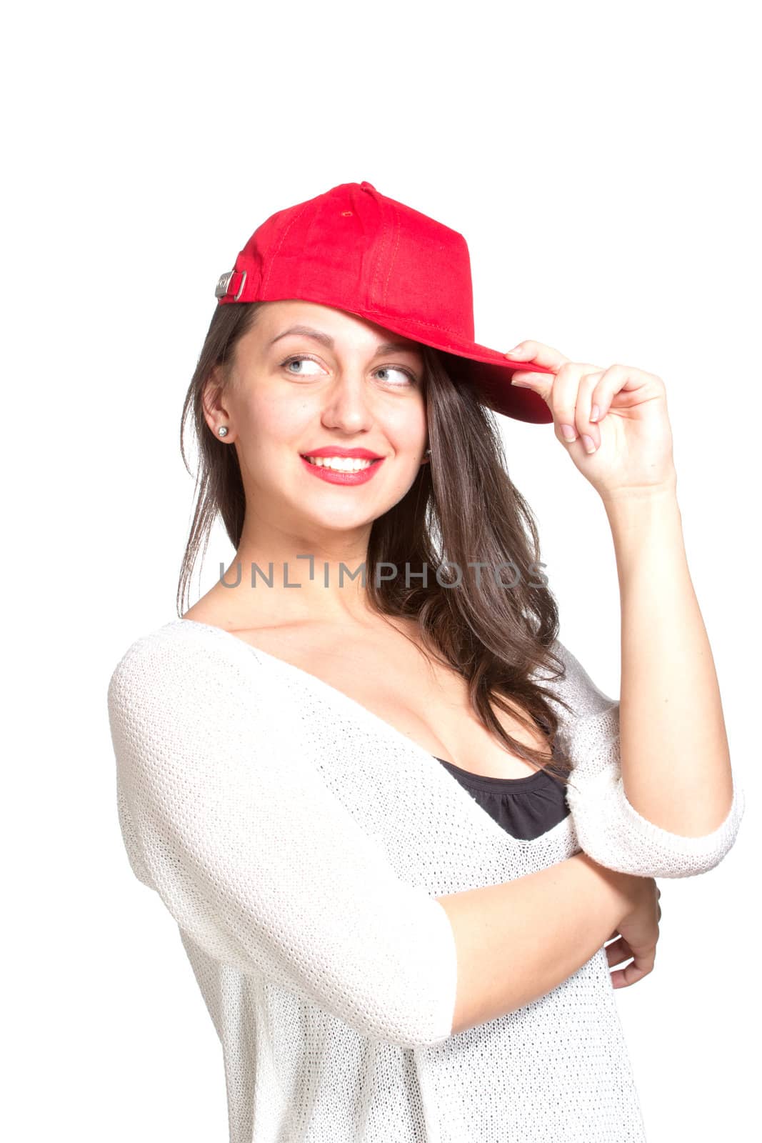 Attractive young woman wearing a red baseball cap, isolated