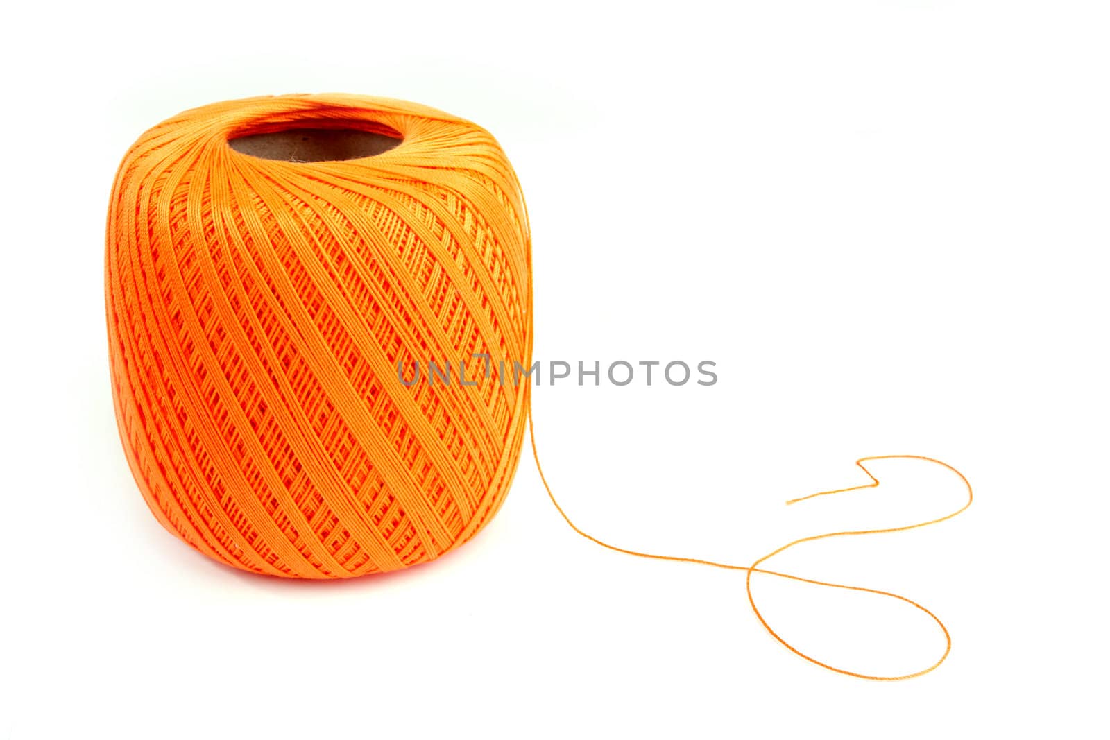 Isolated orange coton spool against white background