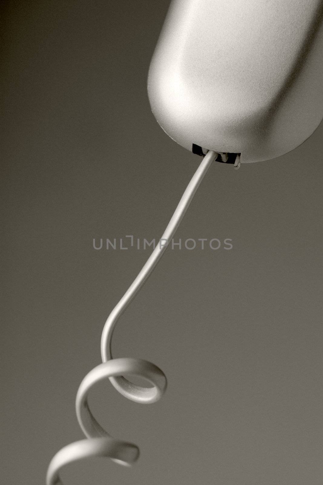 Plugged telephone cable over grey background