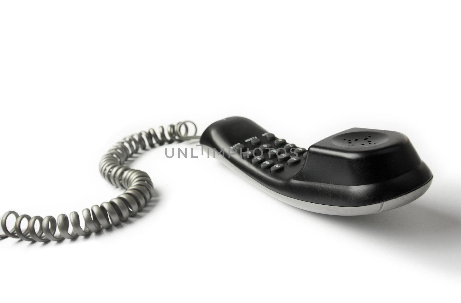 Wired telephone against white background