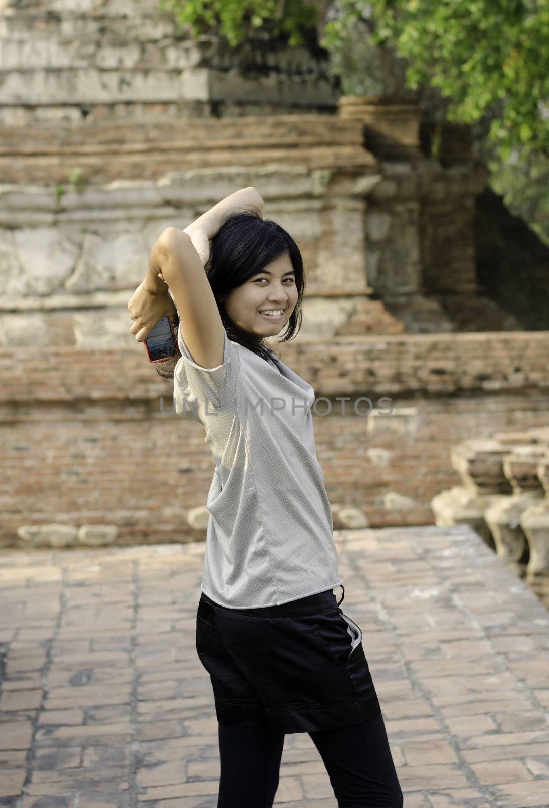 Asian woman at Wat Maheyong Temple. Ayutthaya province - Thailand 