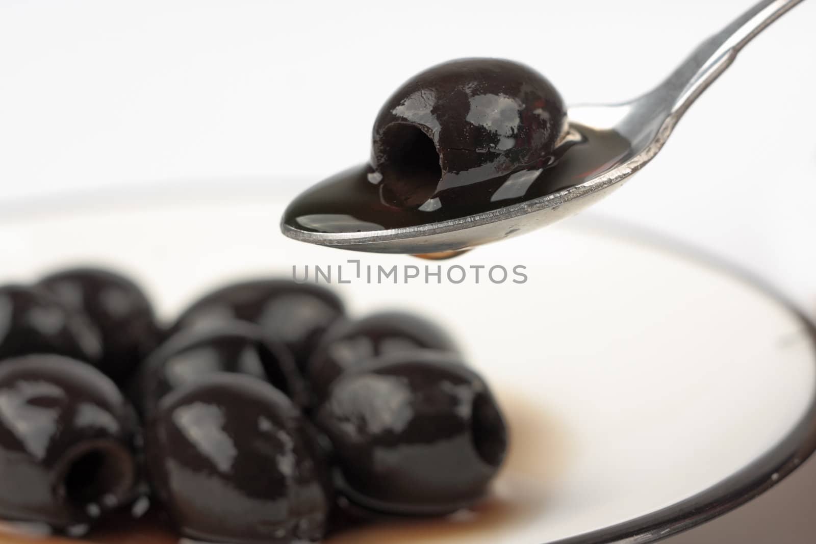 Black olives on white background