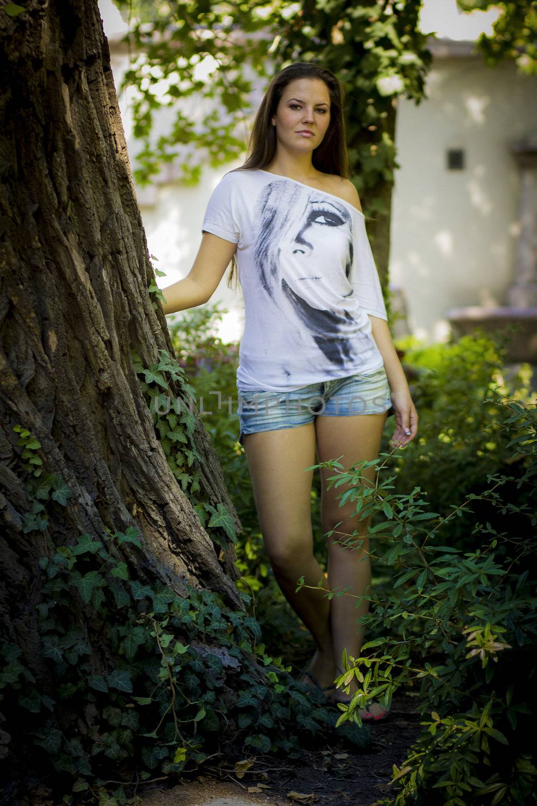 Young woman in the forest on a sunny day