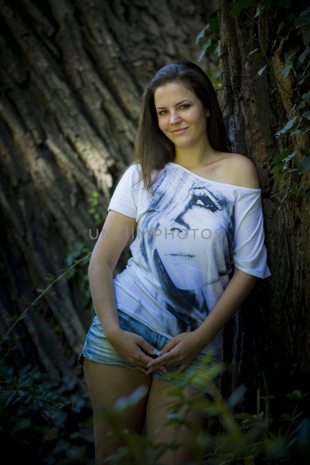 Young woman in the forest on a sunny day