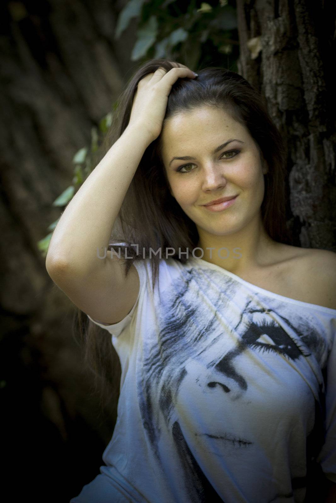 Young woman in the forest on a sunny day