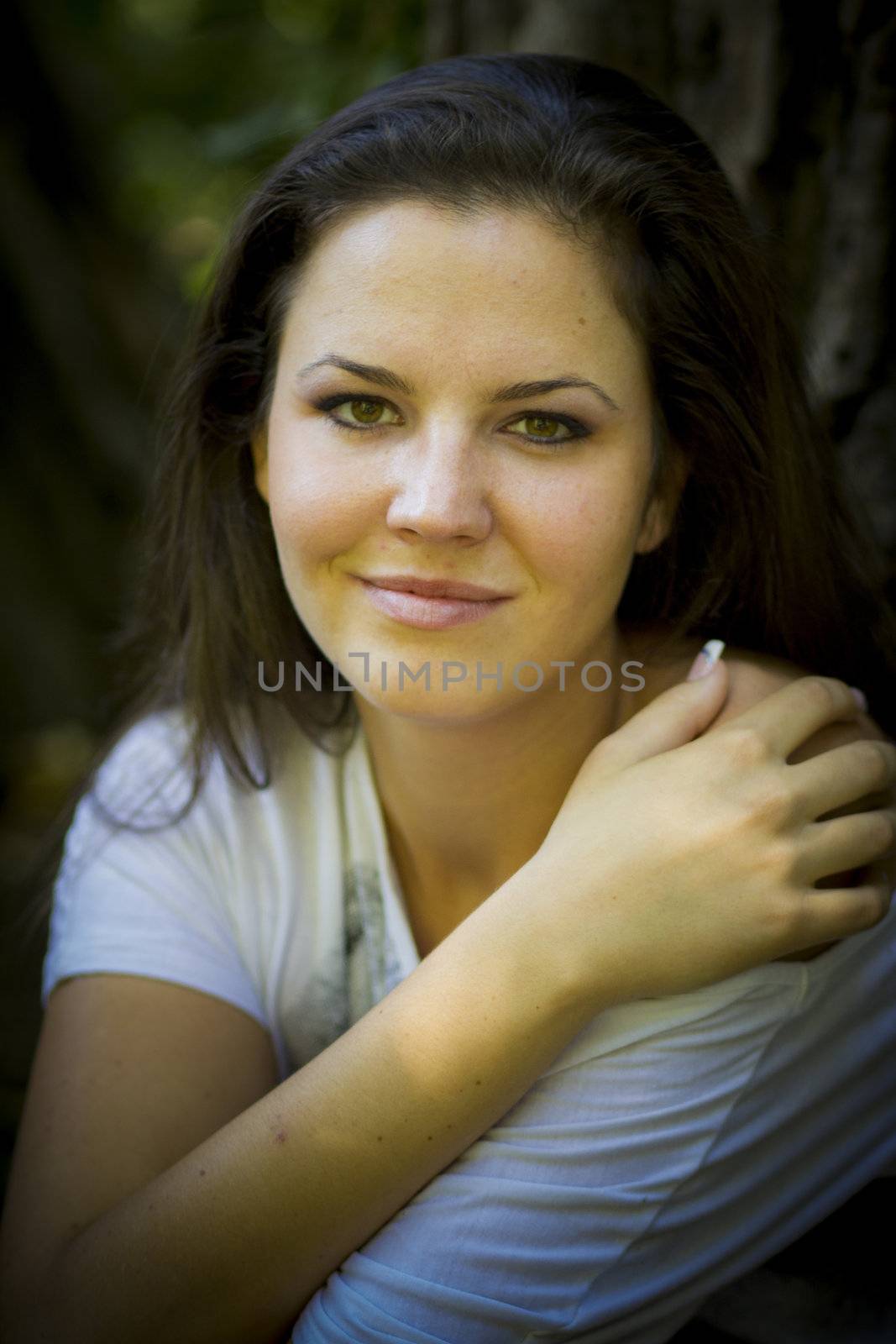 Beautiful young woman in the park on a sunny day