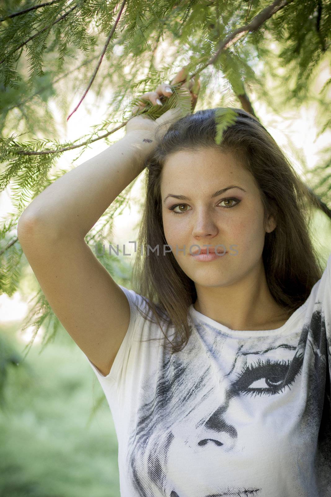 Young woman in the forest on a sunny day