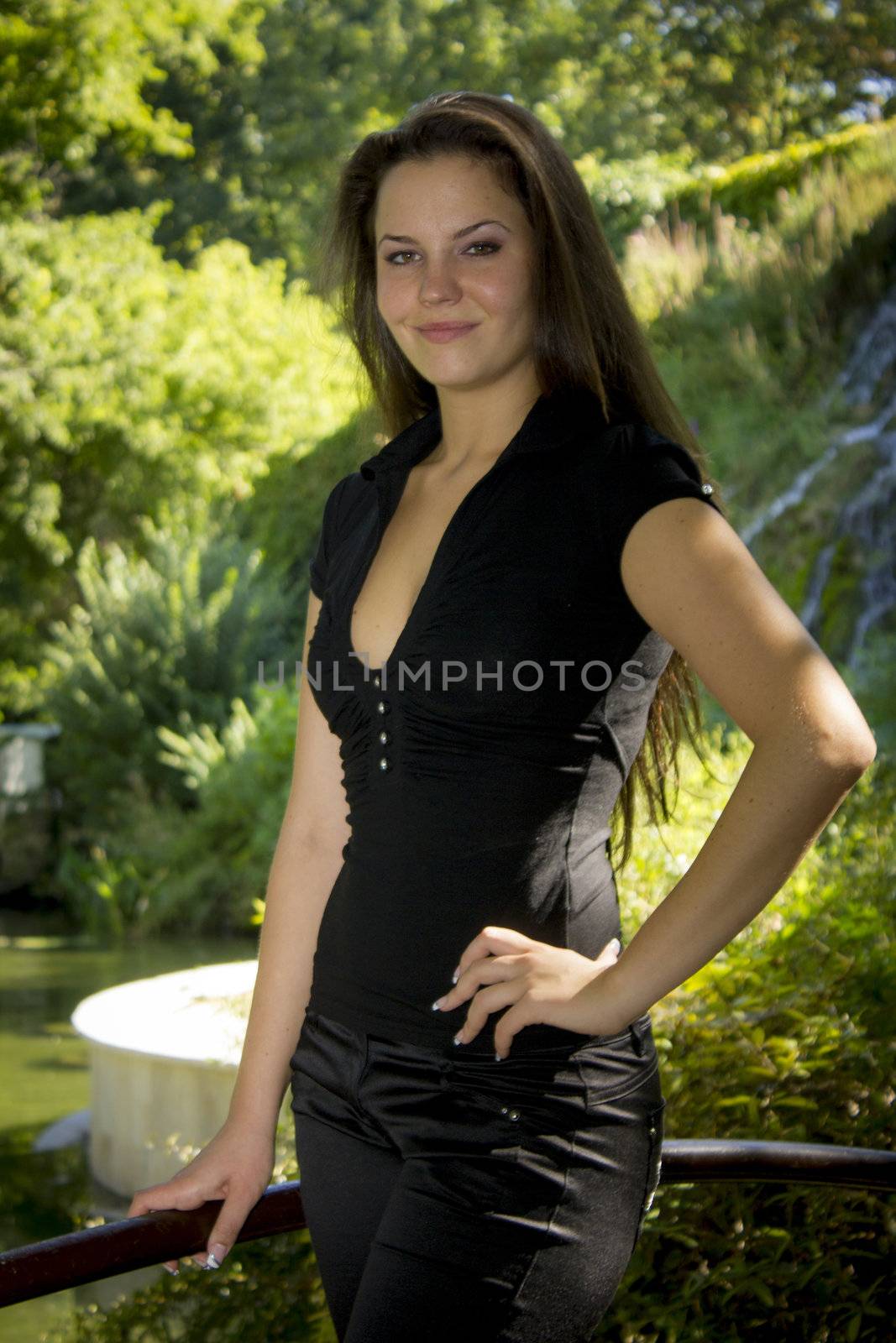 Beautiful young woman in the park on a sunny day