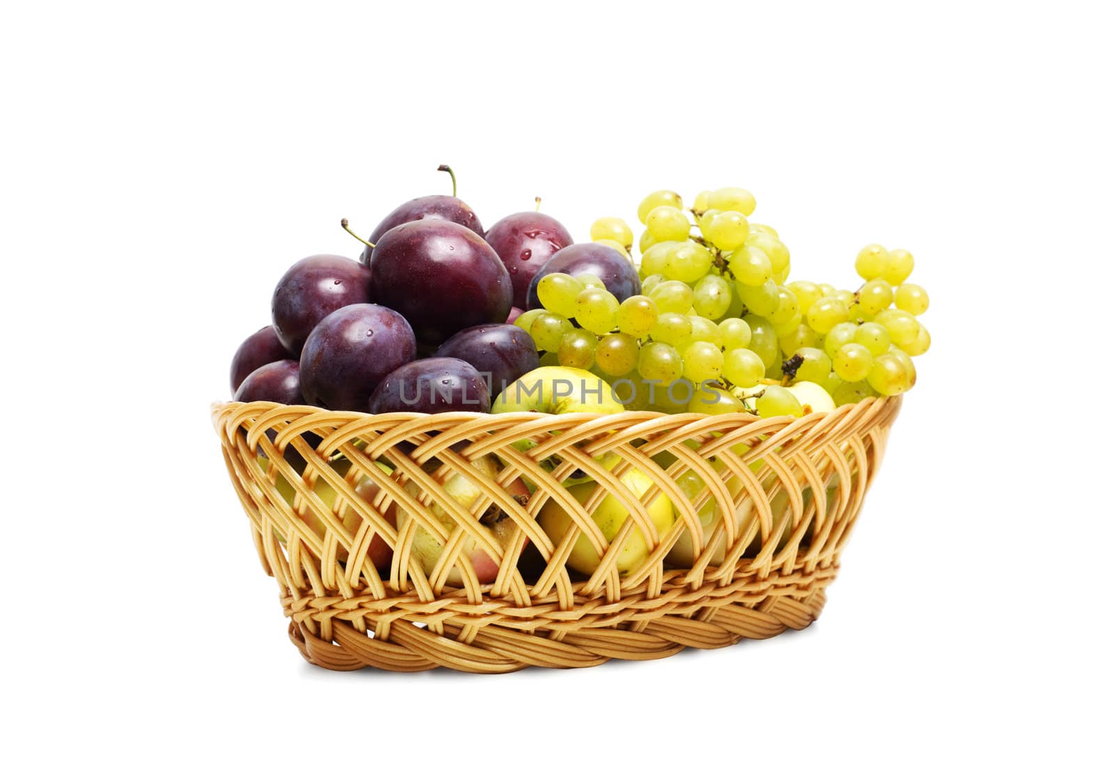 straw basket of fruit on a white background
