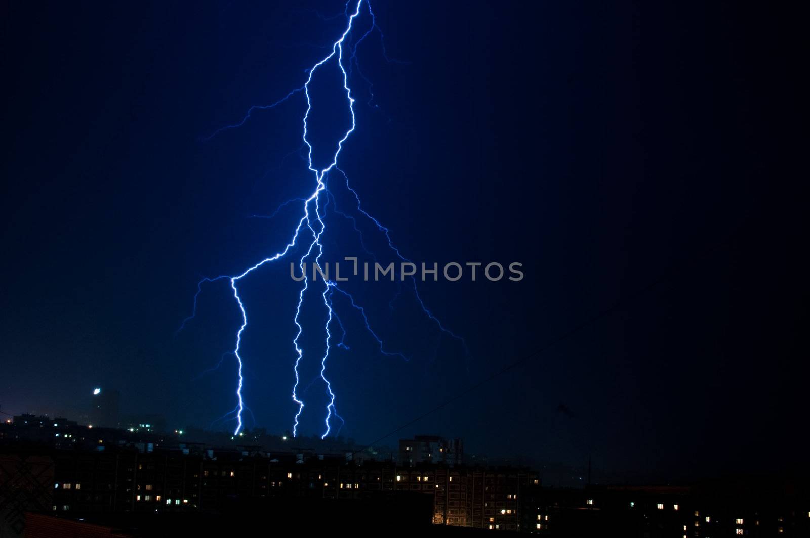 vertical lightning over the city at night. Sky before the storm