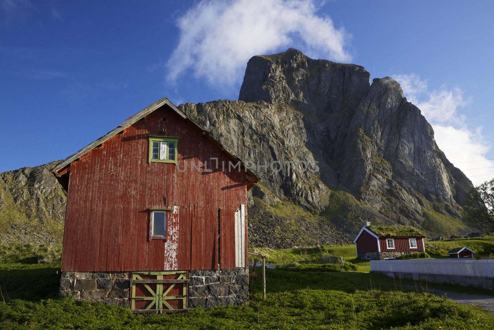 Traditional red wooden houses in norwegian village Nordland on island of Vaeroy, Lofoten