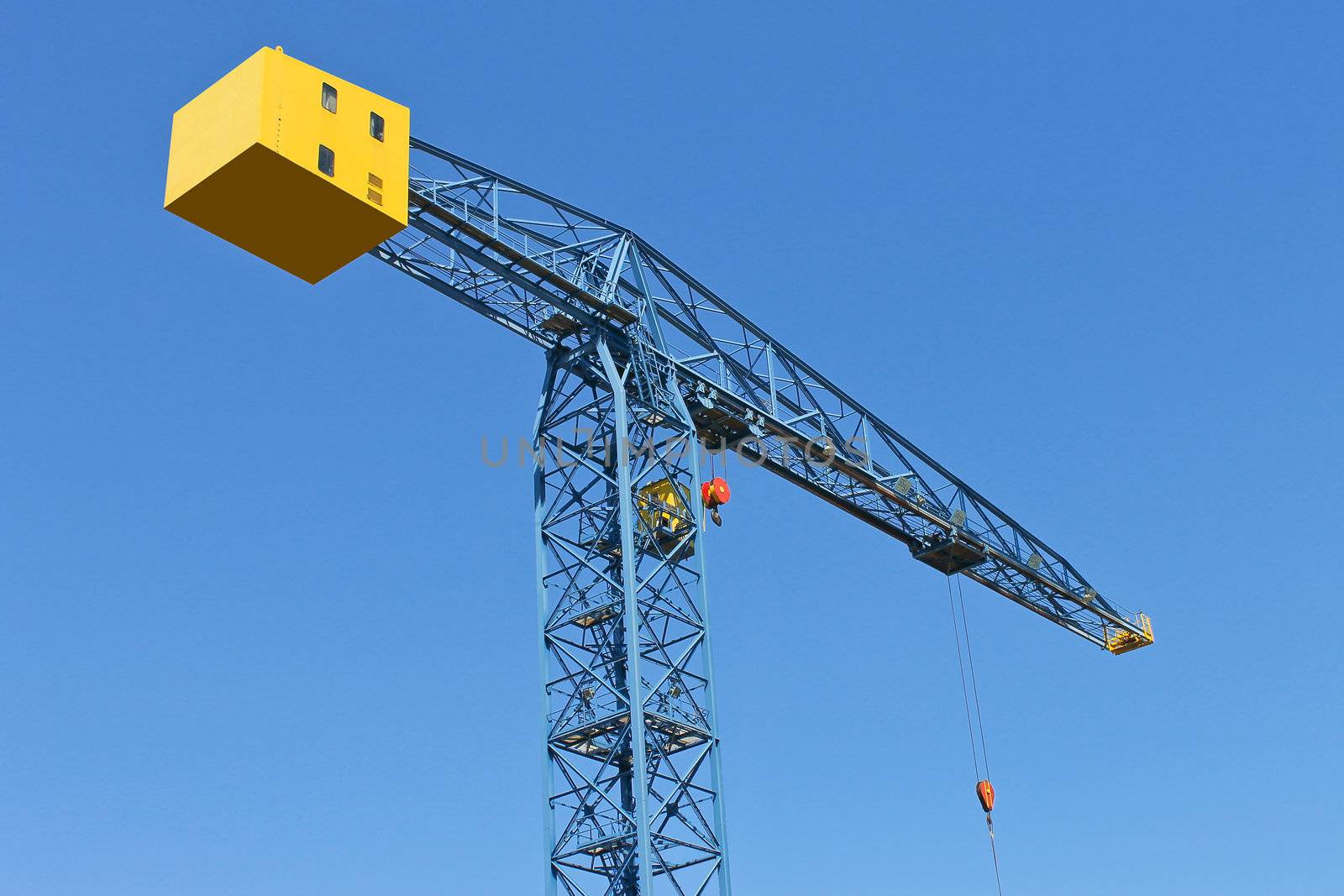 Shipyard crane against the blue sky