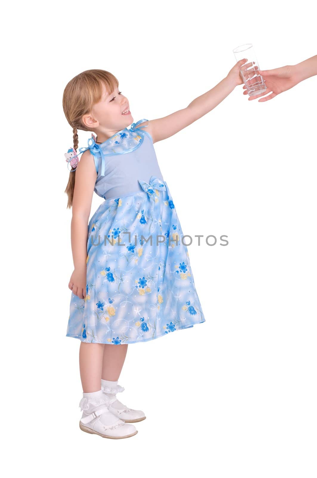 Little girl taking a glass of water on white background