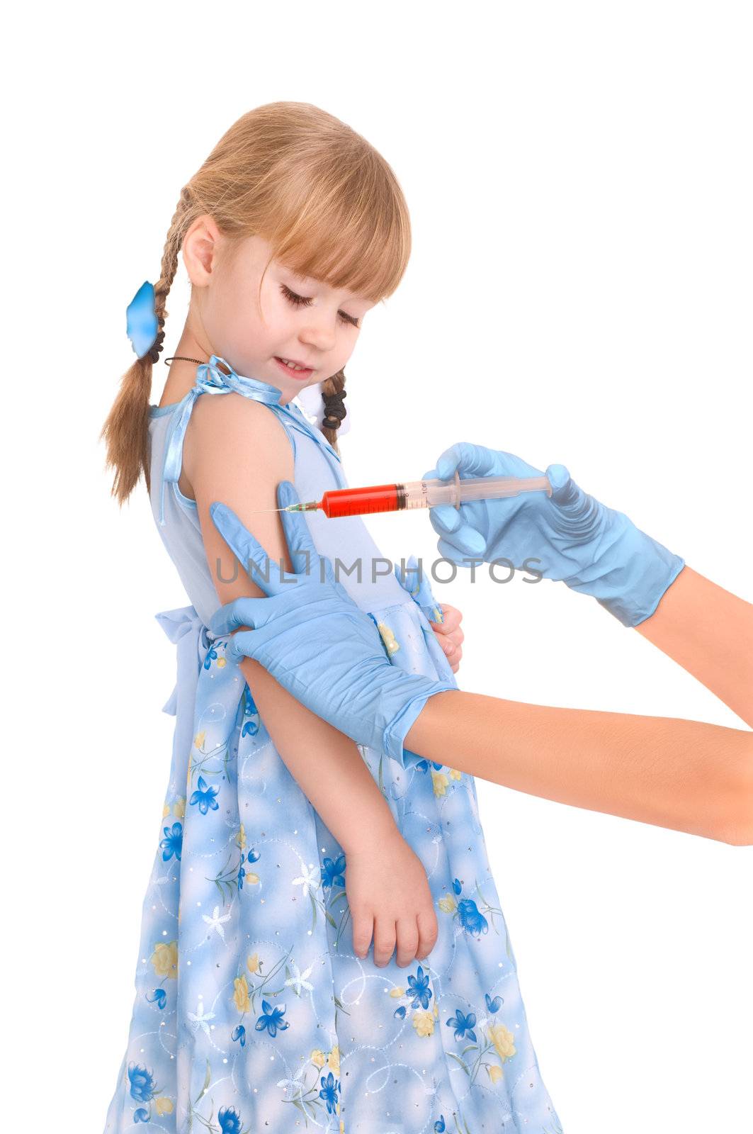 doctor making a vaccination for a child on white background