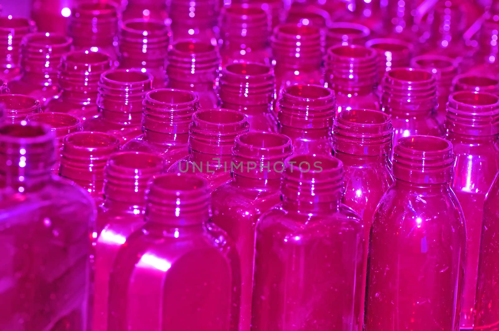 lilac empty bottles as a containers for shampoo for background