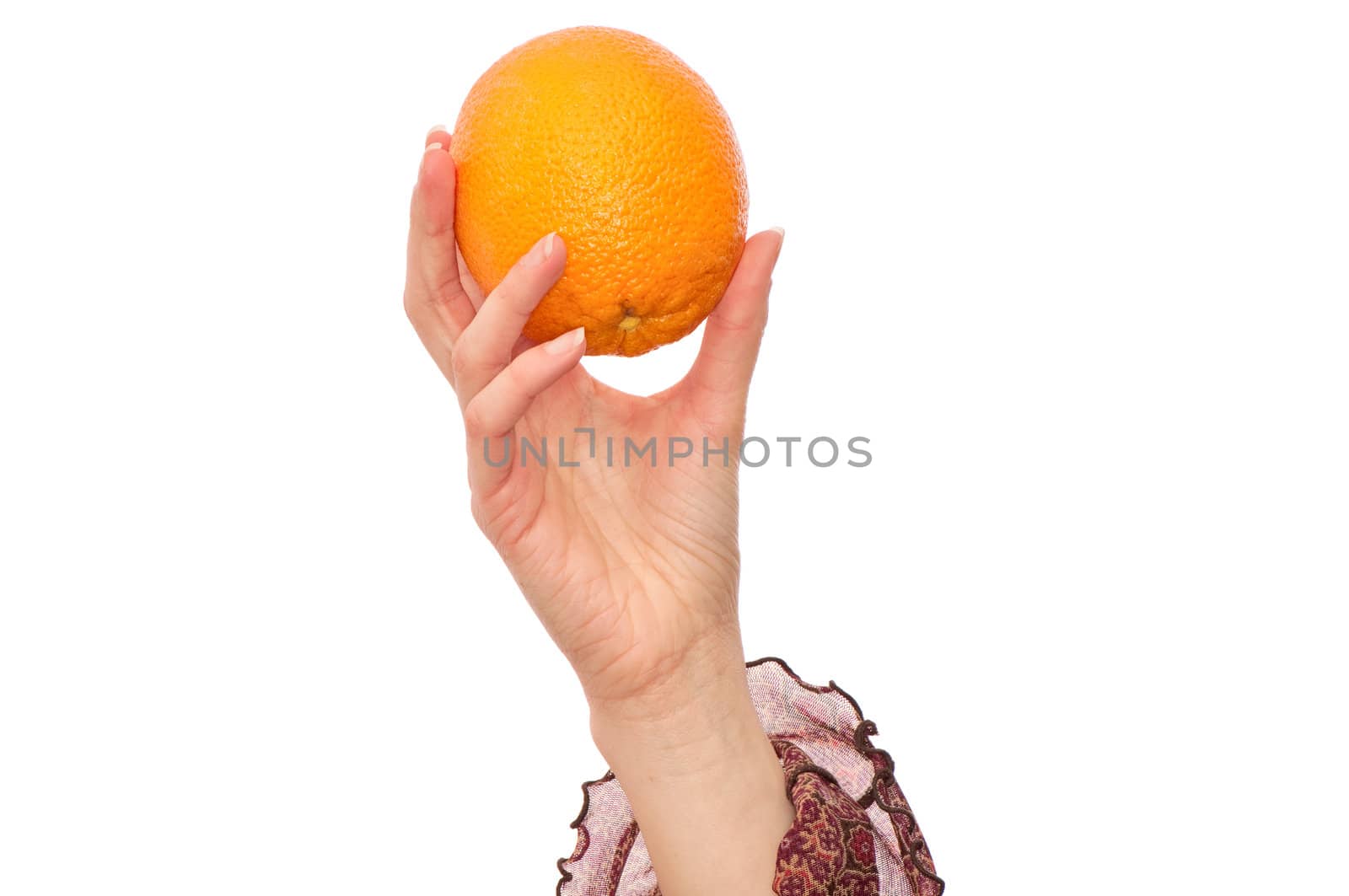 orange in the woman's hand for keping the diet