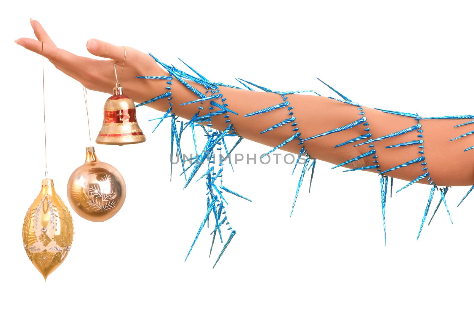 Christmas-tree decorations in the hand on white background