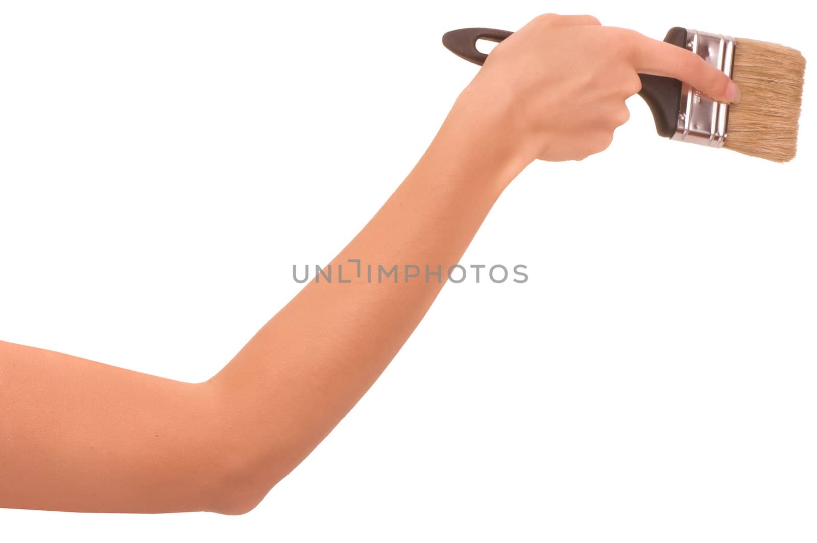 The woman draws the brush on the wall