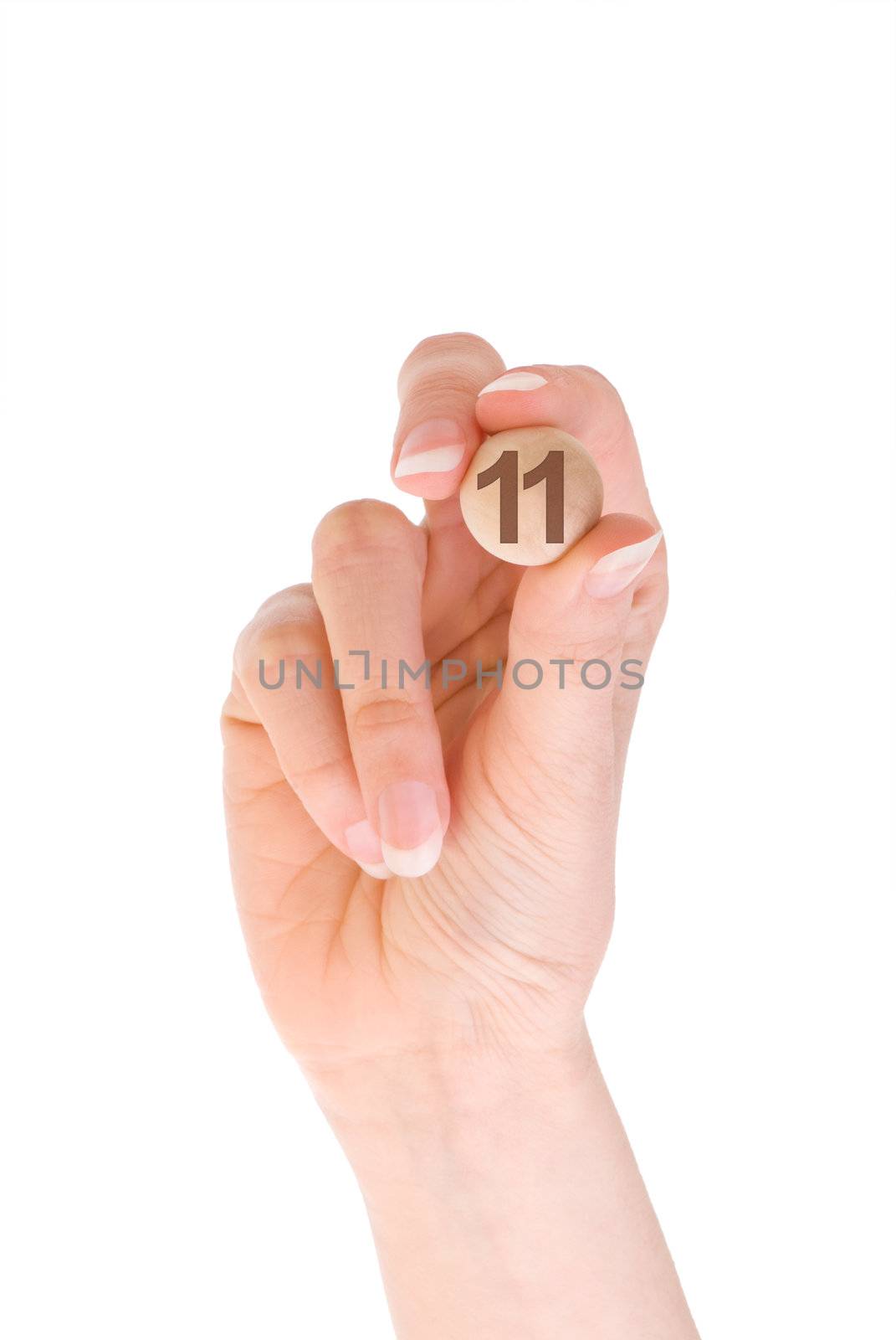 eleven bingo ball in the hand on white background