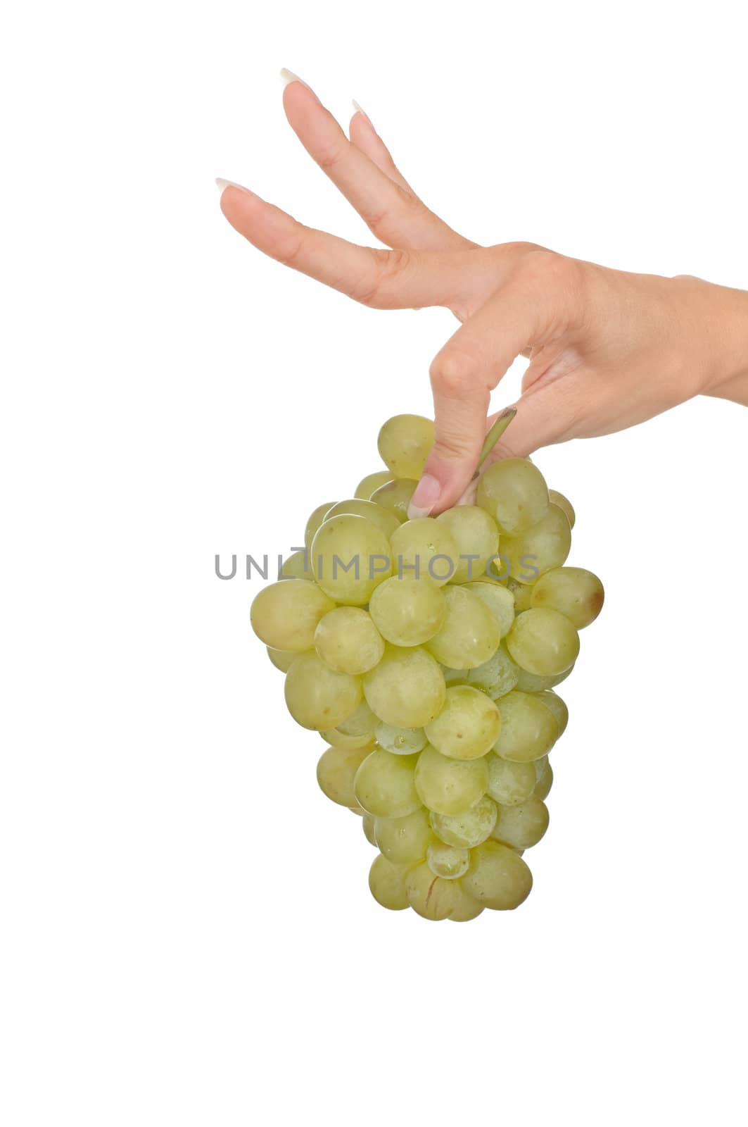 a branch of green grape in the woman's hand