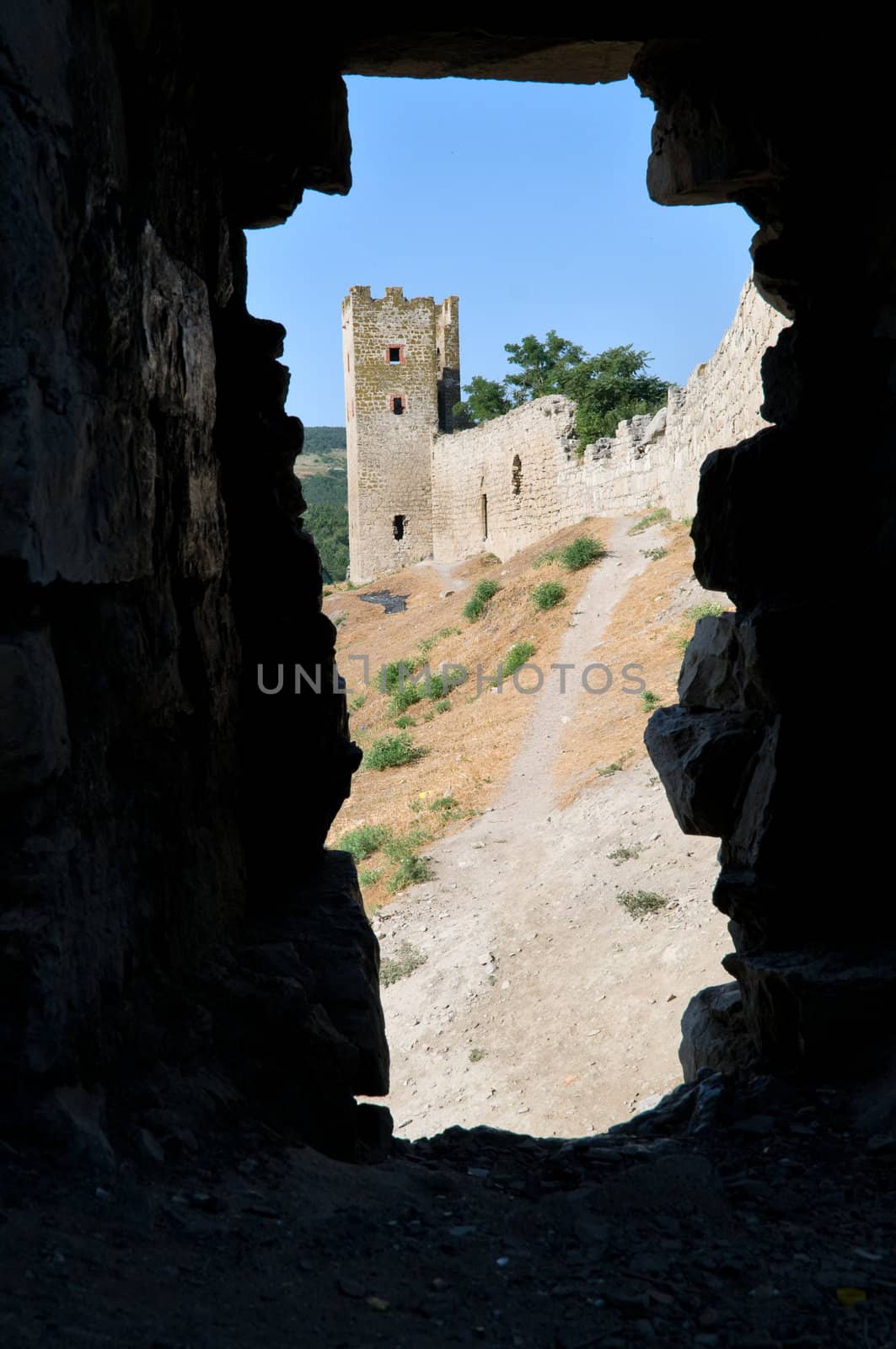 genovese stronghold through the old window on dark background