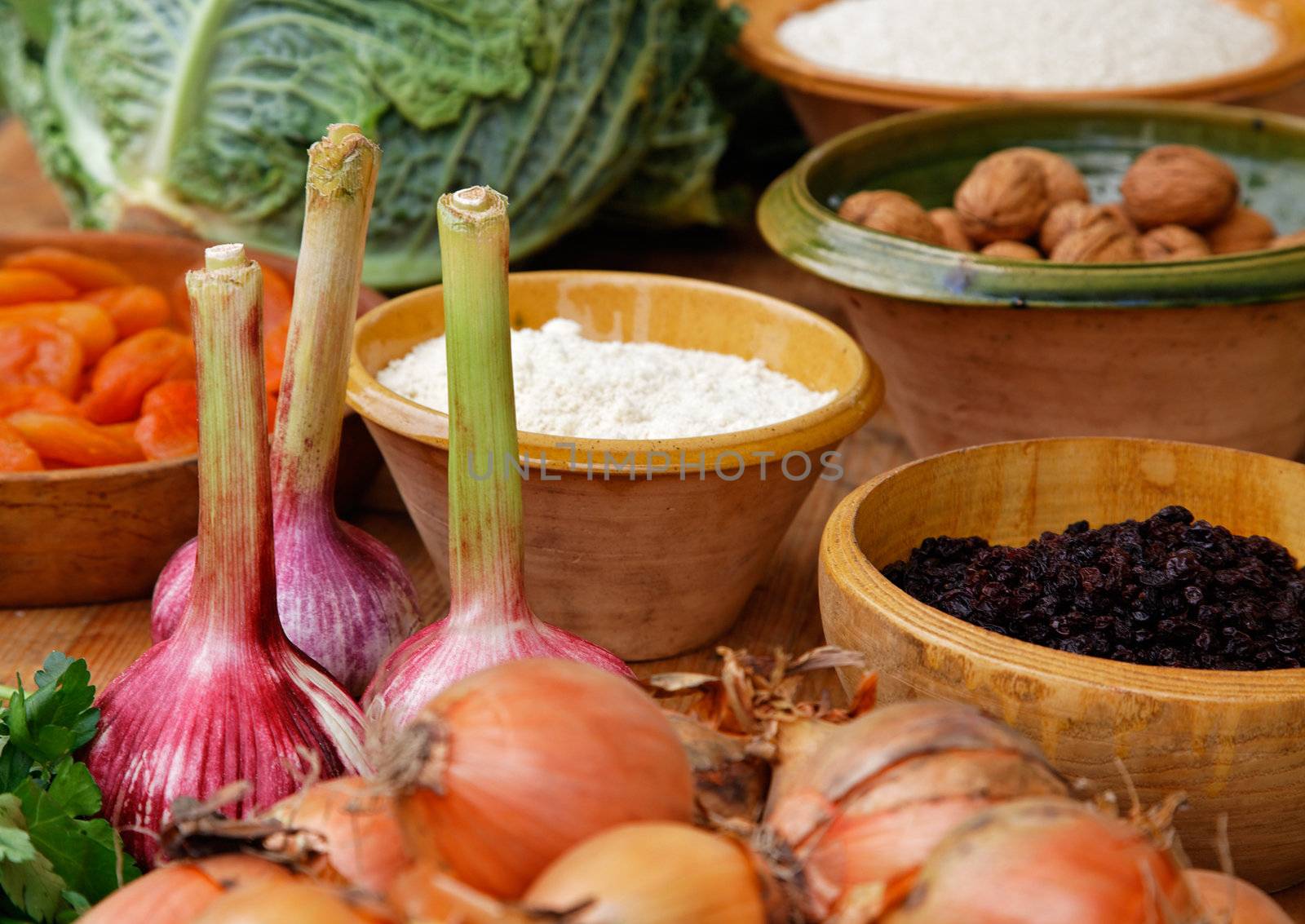 Close-up image of a wooden table full of natural food ingredients.