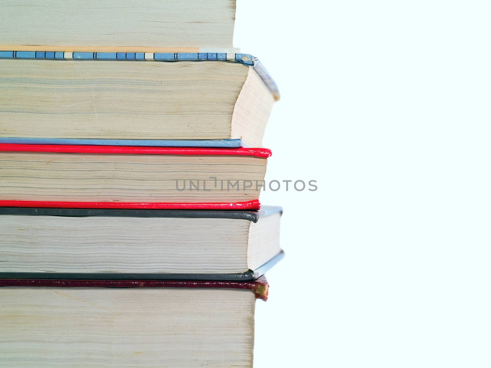 Old Textbooks stacked on a blank background