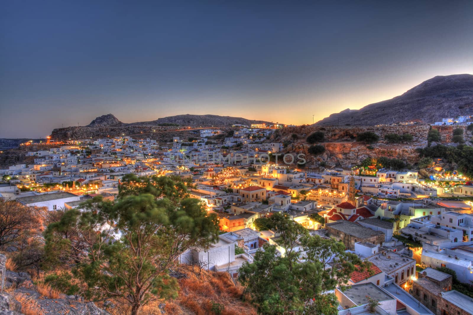 Looking over the rooftops of Lindos village at twilight in high dynamic range