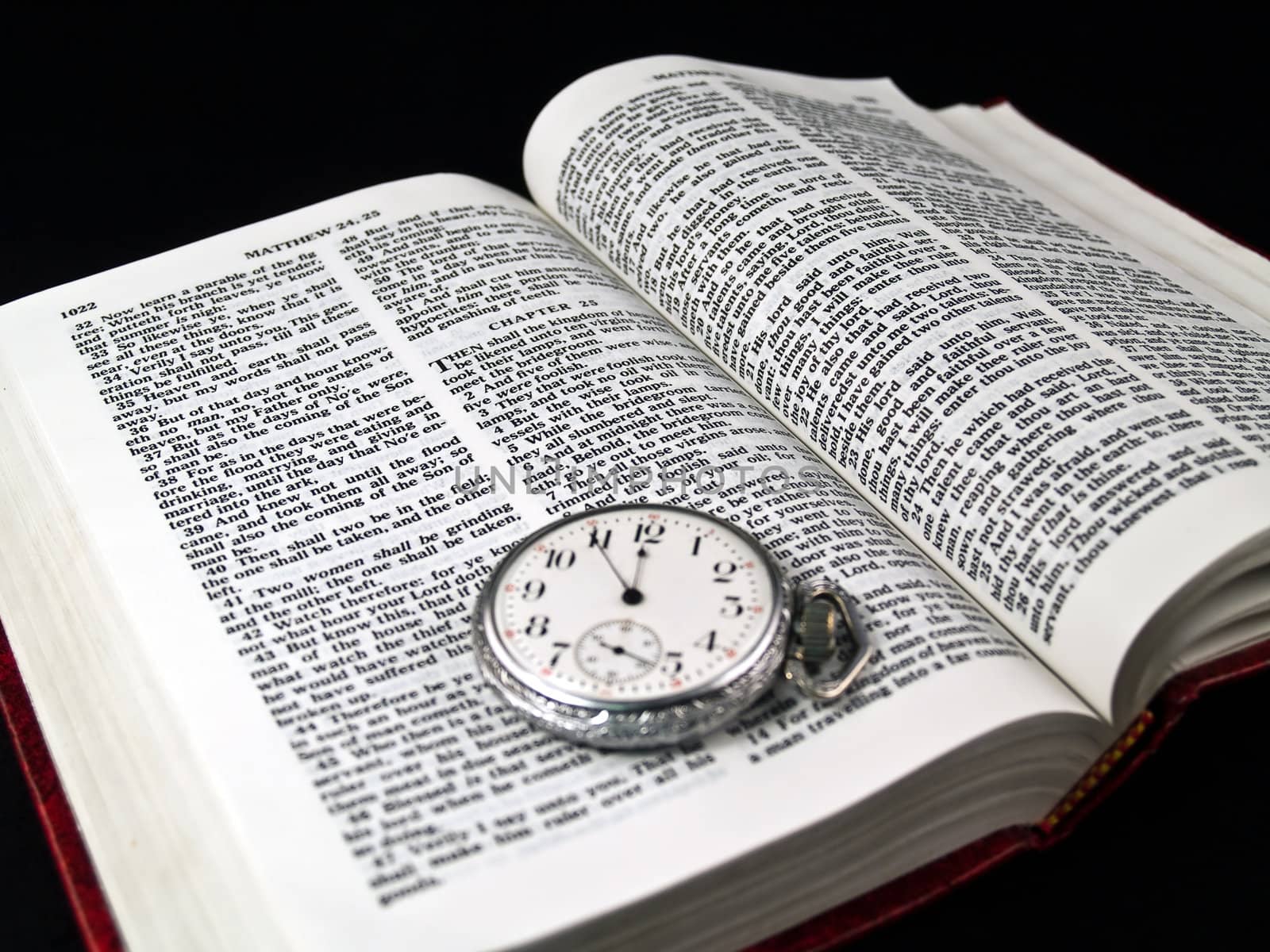 The Bible opened to Matthew 24: 36 with a Pocketwatch by Frankljunior