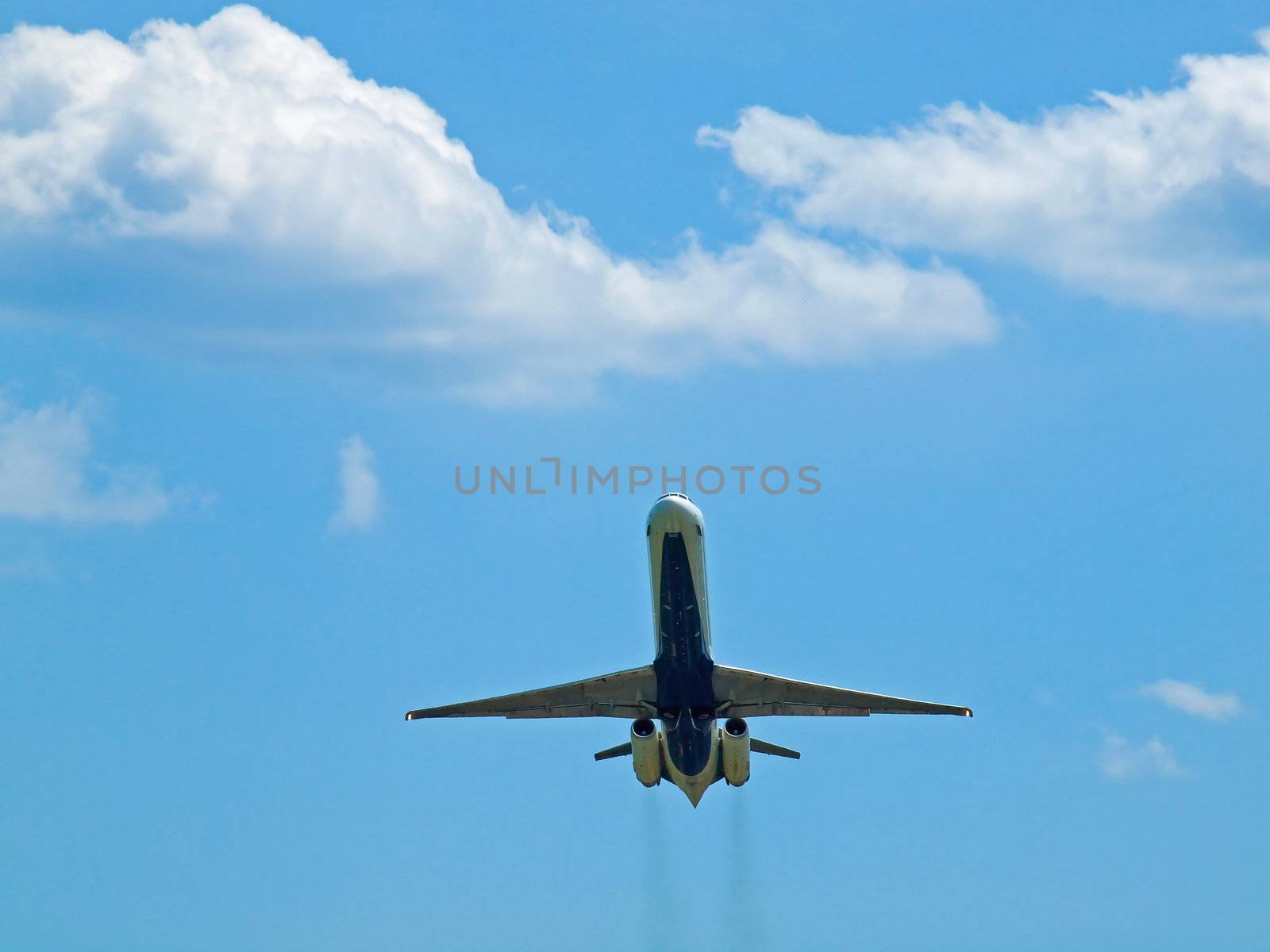 A Commercial Airliner Taking Off into a Partly Cloudy Blue Sky by Frankljunior