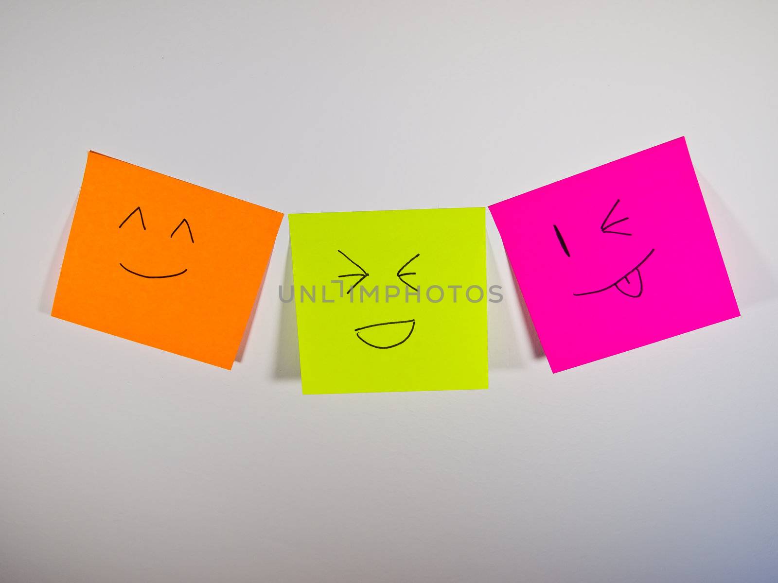 Colorful smile on post-it with white background by gjeerawut