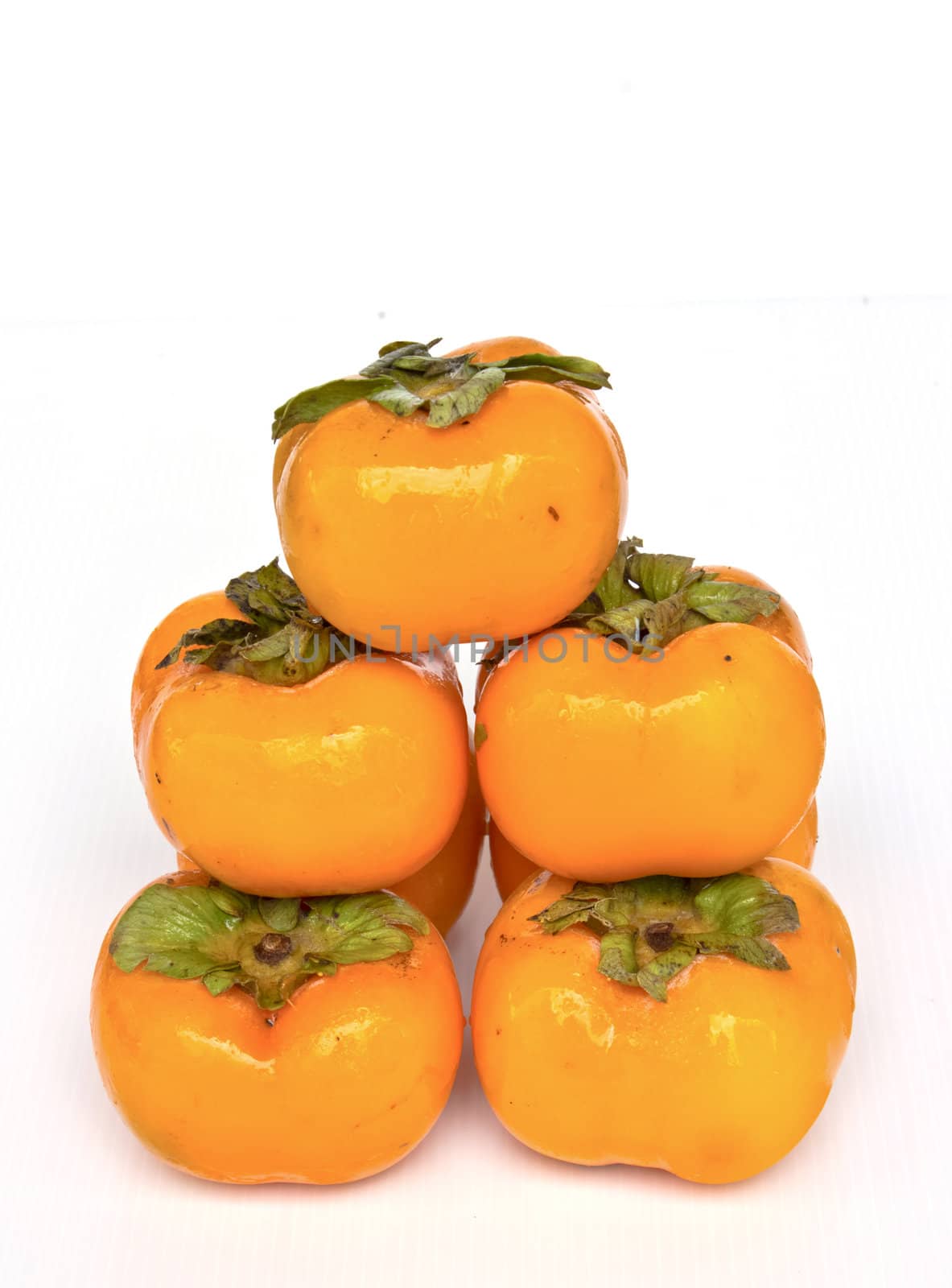 orange persimmon on white background