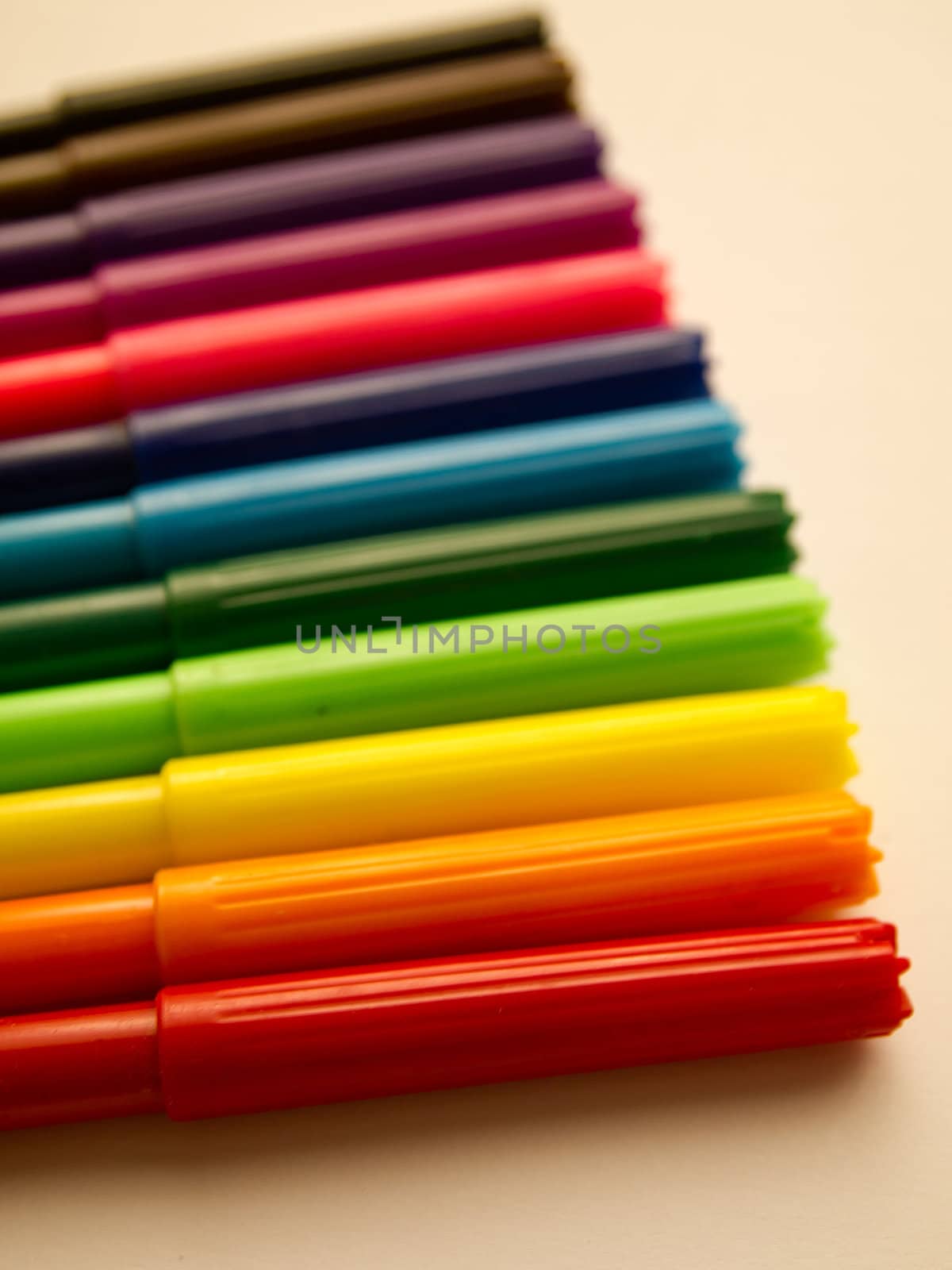 Colorful pens on white background by gjeerawut