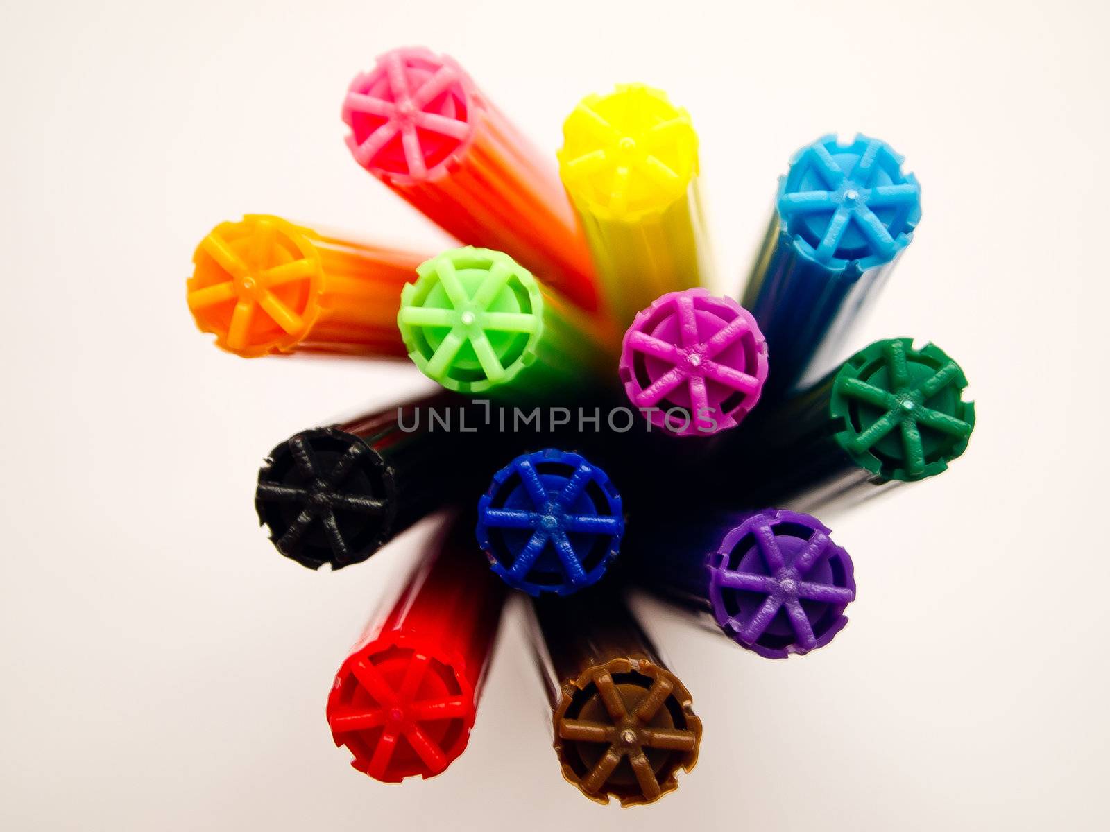 Head of colorful pens on white background by gjeerawut