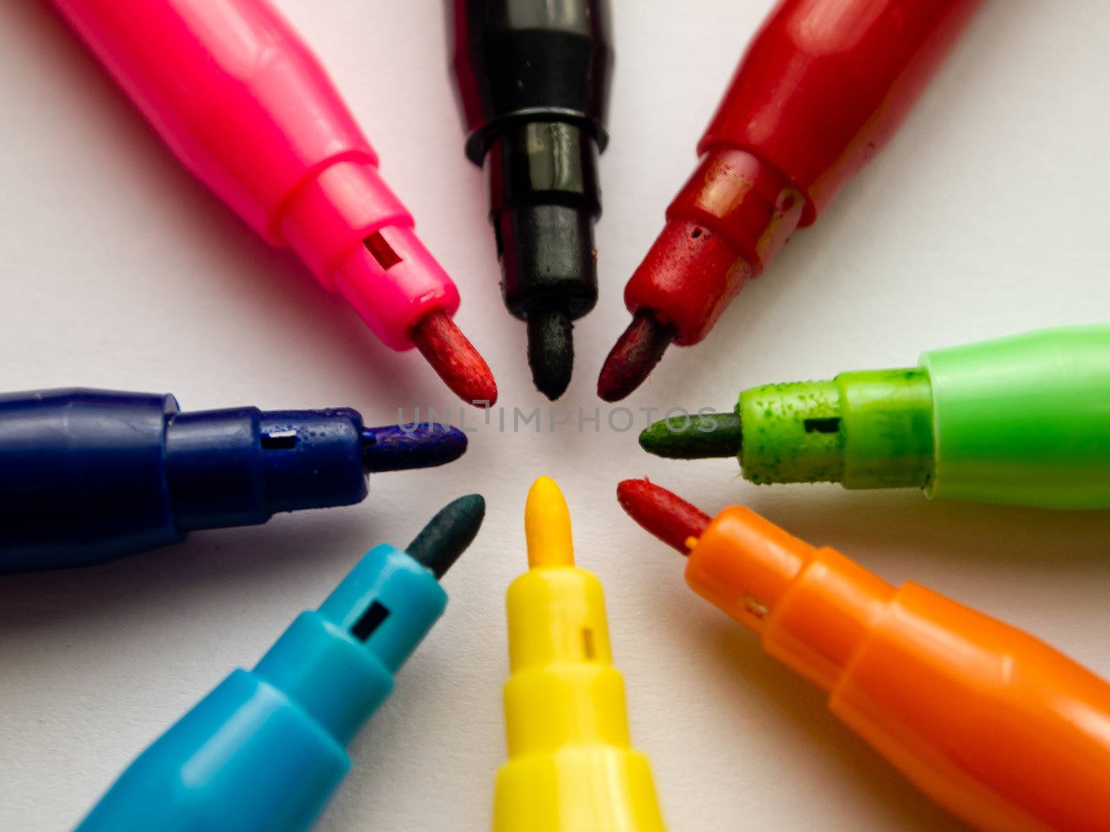 Center of colorful pens on white background