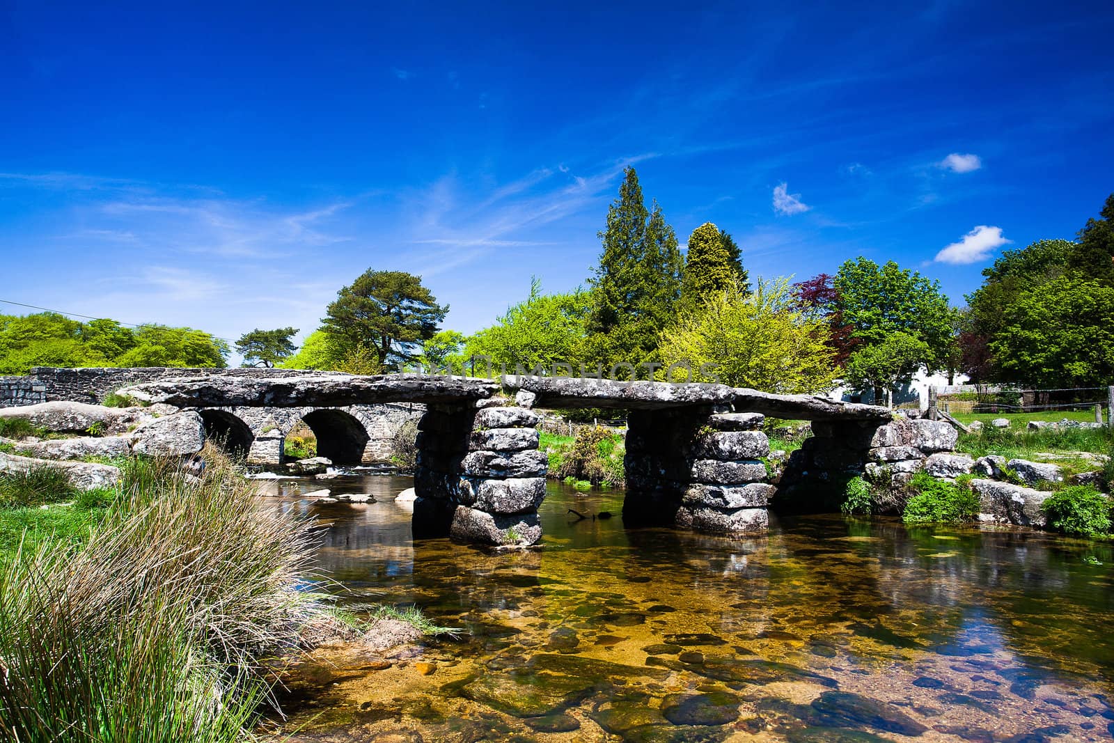 The ancient clapper bridge at Postbridges in Dartmoor National Park, Devon England UK