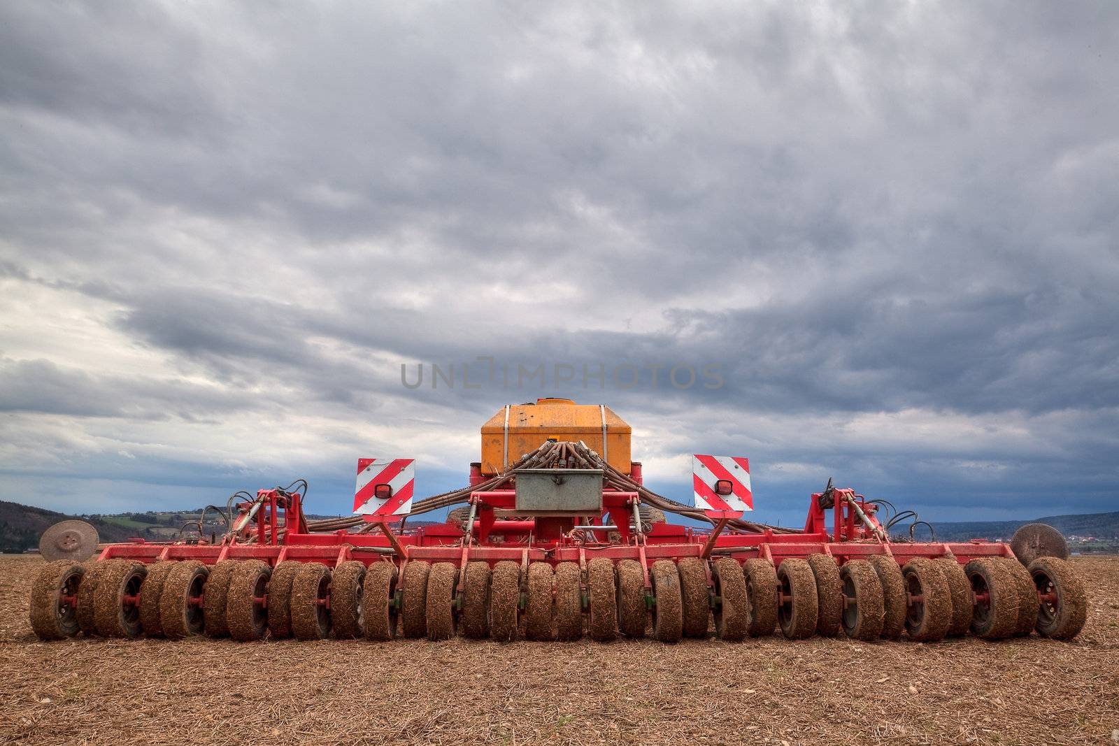 Machinery sitting after storm in a wheat field
