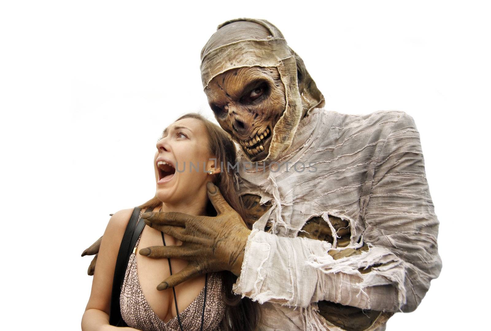 Mummies bandaged and decomposing hand grabs the young woman. The girl lets out a dramatic scream with a surprised startled look. White background