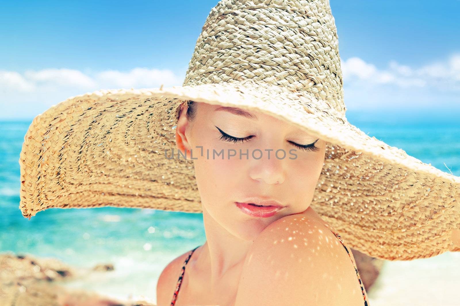 Beautiful woman on a beach on a sunny day 