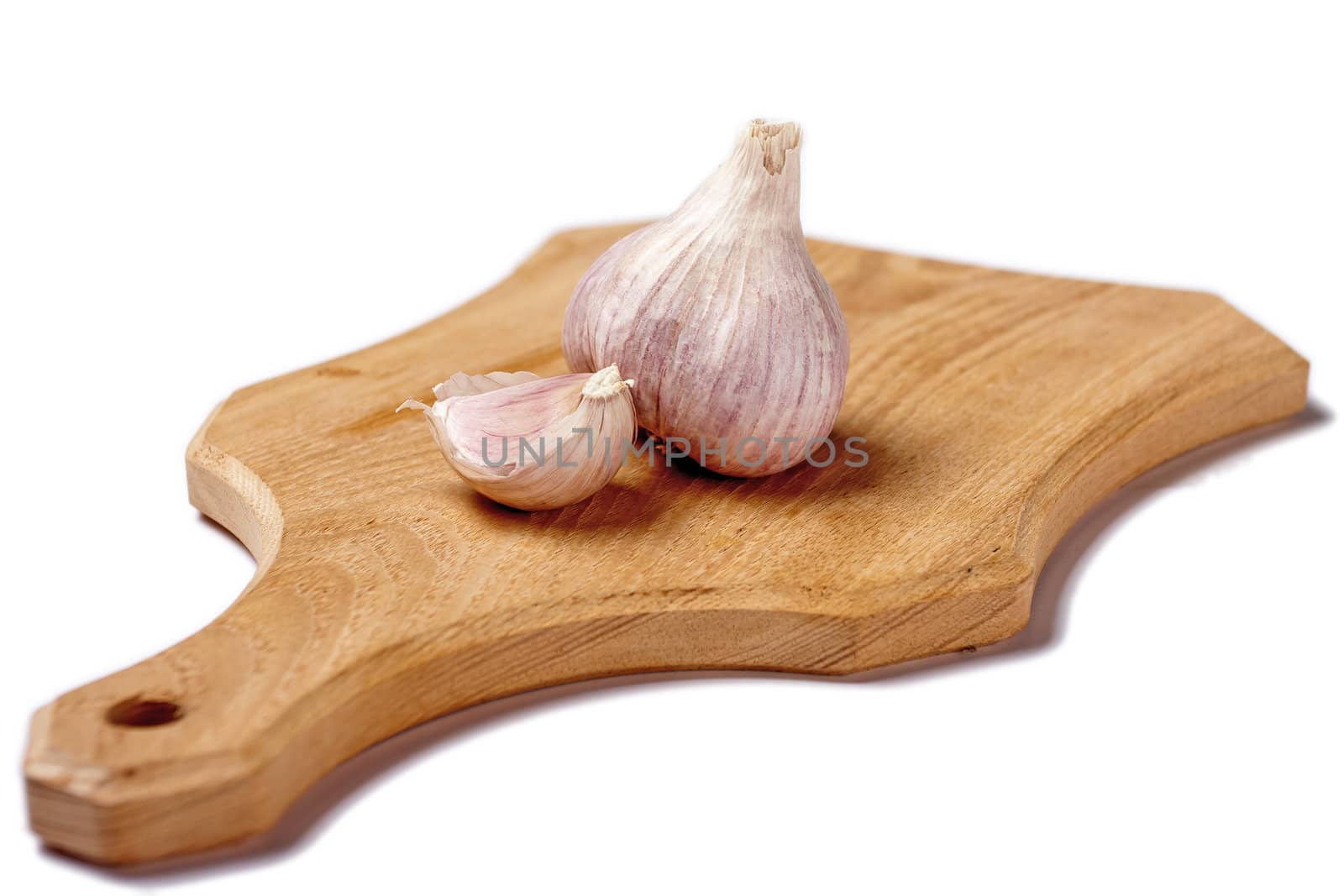 Garlic on cutting plate isolated
