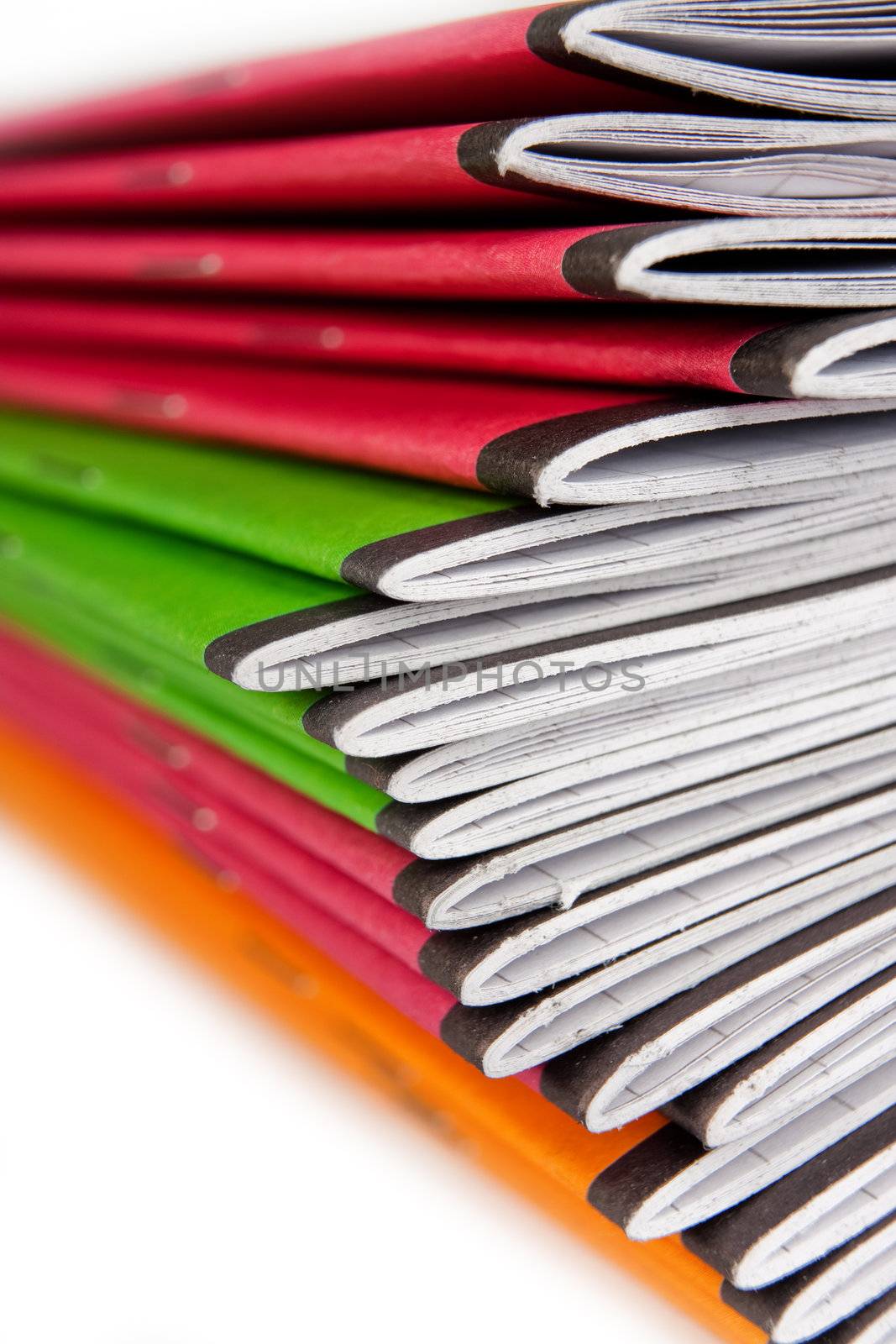 Stack of color notebooks by Verdateo