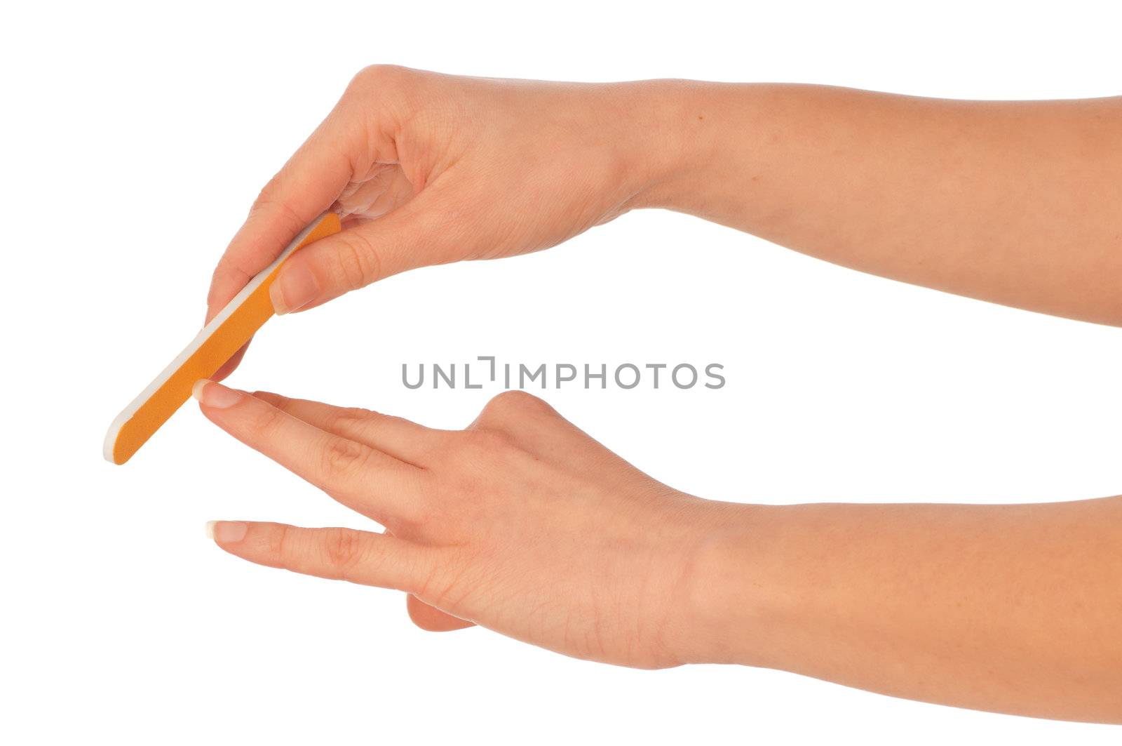 woman files her nails by emery board from manicure set