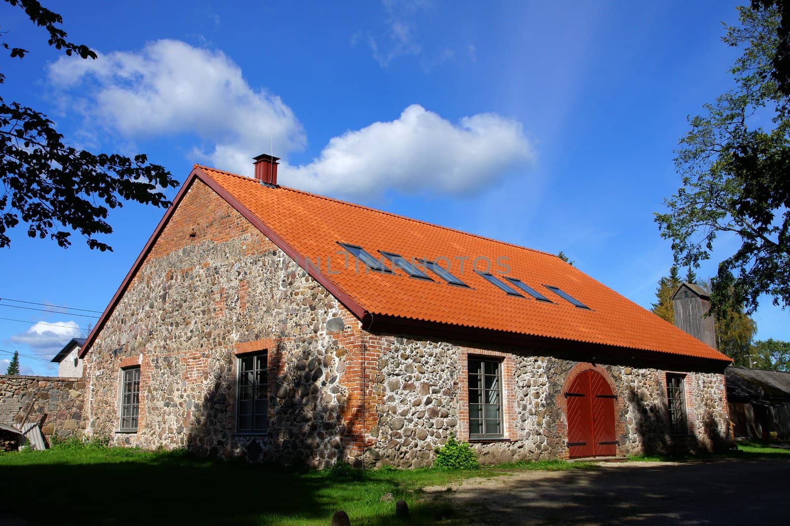 Old stone shed on a background of the sky