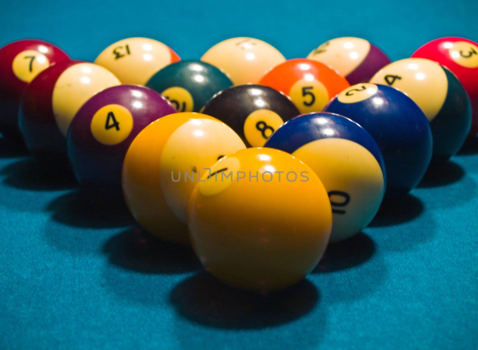 Billiards balls on a green pool table by Frankljunior