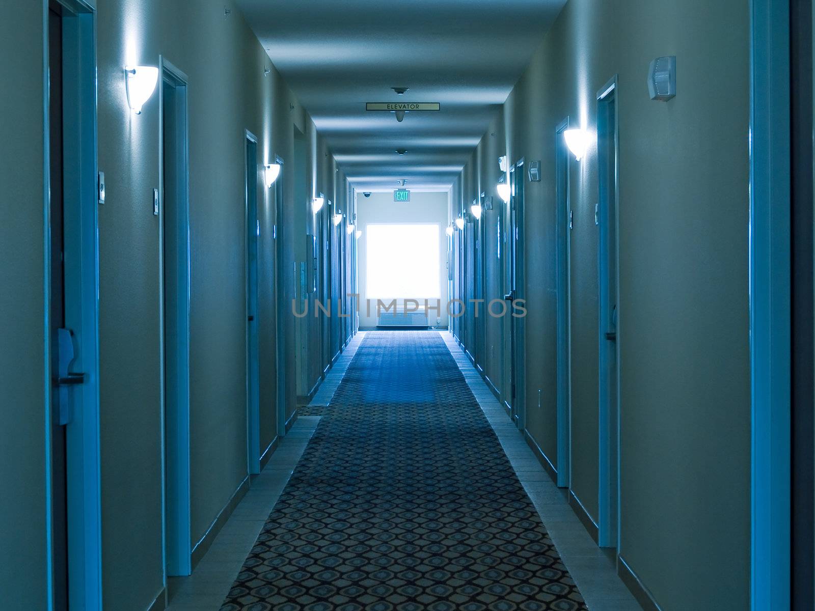 Empty hotel corridor in monochrome blue color tone by Frankljunior